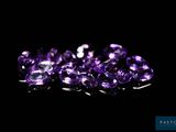 purple amethorate gems on a black background
