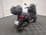 a motorcycle that is parked on a checkered floor