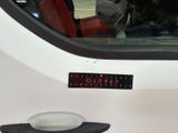 a sticker on the side of a white car