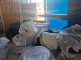 a room that has a lot of bags of stuff on the floor