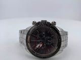 the watch is sitting on a white surface with a white background