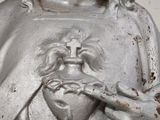 a statue of jesus holding a heart in his hands
