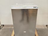 an image of a stainless steel dishwasher sitting on a pallet in a warehouse