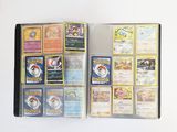 a lot of pokemon cards in a box on the table