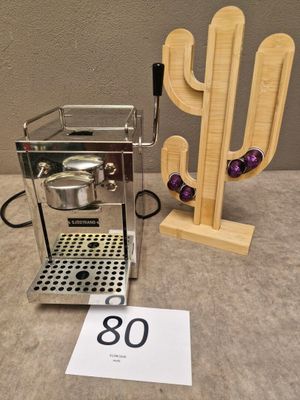 a coffee maker and a cactus on a table