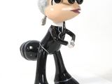 an image of a figurine of a woman in a suit and sunglasses