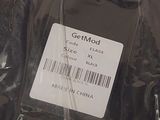 a plastic bag with a tag on it that says getmod