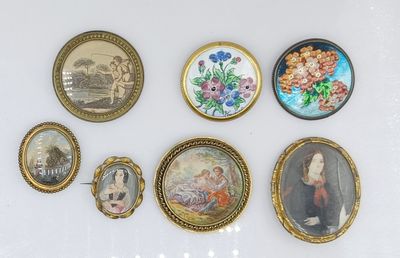 a lot of pictures on the wall of this room