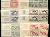 a group of stamps with different designs on them on a black surface