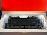 a box with a toy train in it on a table