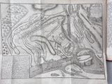 an old map of a town in the middle of a book