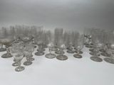 a lot of glasses that are sitting on a table