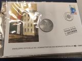 an envelope with a picture of a building on the inside of it