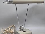 an image of a desk lamp with a cord attached to it