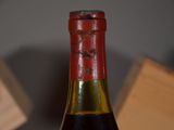 a bottle of wine that is sitting on a table