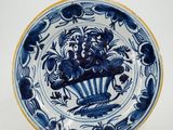 an image of a blue and white plate with a lion on it