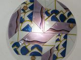 a plate that has a design on it on the wall