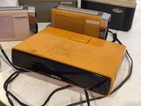several old radio ' s sitting on a table next to each other