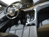 the interior of a car with a laptop on the dashboard