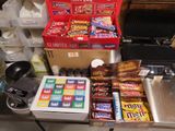 boxes of candy and candy bars are on a counter in a store