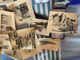 many old photos on a blue and white striped chair