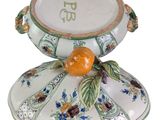 an image of a decorative bowl with a fruit on it