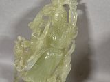chinese carved jade figurine of a woman holding a sword
