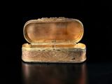 a gold box that is sitting on a table
