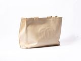 a chanel bag with a logo on the front