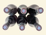 six bottles of wine sitting on top of each other
