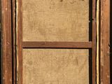 an old wooden picture frame with a piece of wood sticking out of it