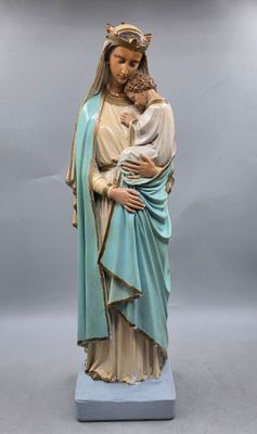 a statue of a woman holding a child in her arms