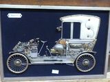 a picture of an old model car in a shadow box