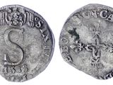 une pièce d'argent sur laquelle figure un serpent au recto et un serpent au verso