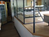an image of a kitchen with a counter and a refrigerator