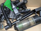 a box full of vacuums and other household items in it