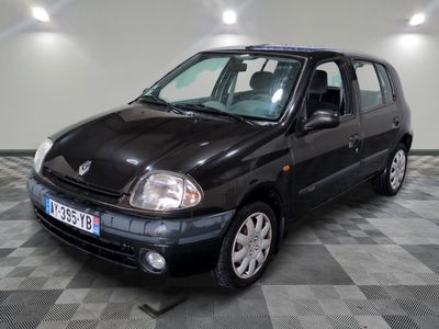 a picture of a small black car parked in a garage
