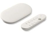 a remote control sitting next to a white object