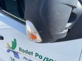 a close up of a vehicle with a parking meter on the side of it