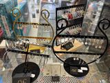 a display of jewelry in a glass case in a store