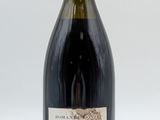 a bottle of wine that is sitting on a table