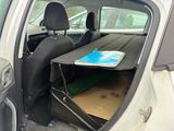 a car that has a table in the back of it