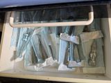 a drawer with a bunch of surgical items in it