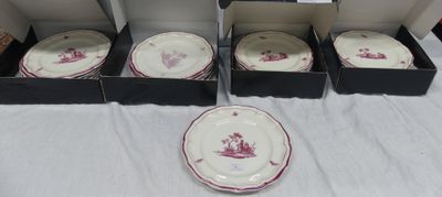 several plates and bowls are sitting on a table in a box