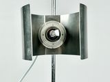 a lamp that is on a metal pole with a white background