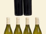 six bottles of wine are lined up in a row