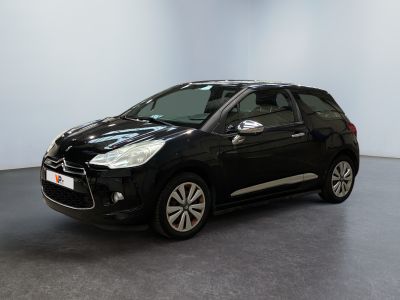 a black citrole is parked in a white room