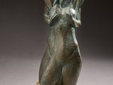 bronze sculpture of a woman holding her head in her hands