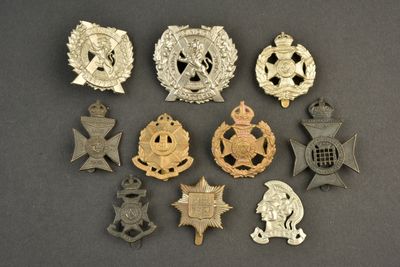 a bunch of badges and badges on a table