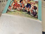 two envelopes with a picture of children playing on a field